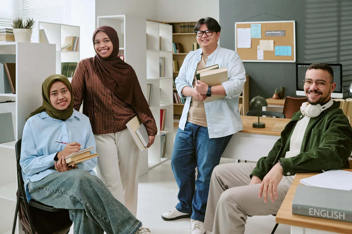Adult learners studying together with books
