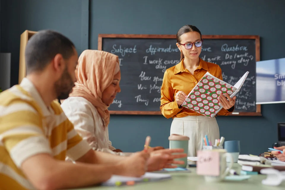 A teacher guiding an adult language class
