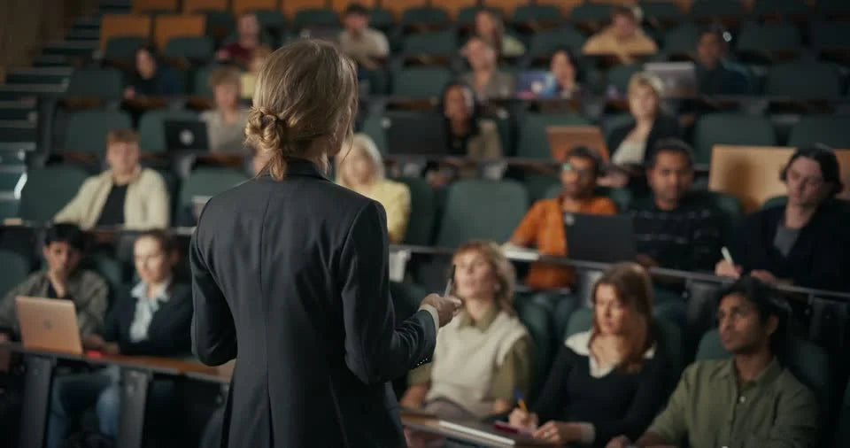 An educator leading a class of adult learners