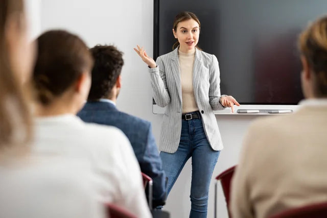 A trainer explaining a topic to adult learners