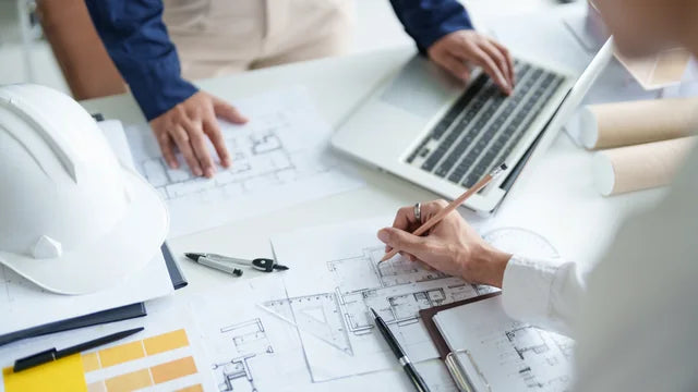 An engineer working with technical drawings